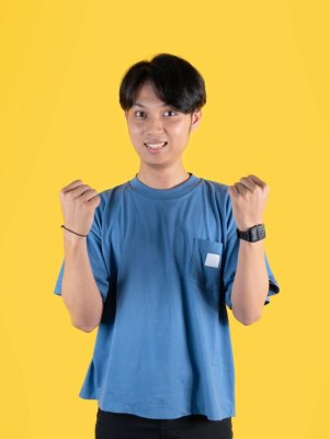 asian-man-with-clenched-fists-to-celebrates-succes-2025-04-28-03-44-00-utc