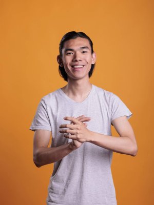 young-cheerful-smiling-asian-man-applauding-2025-02-19-01-34-50-utc